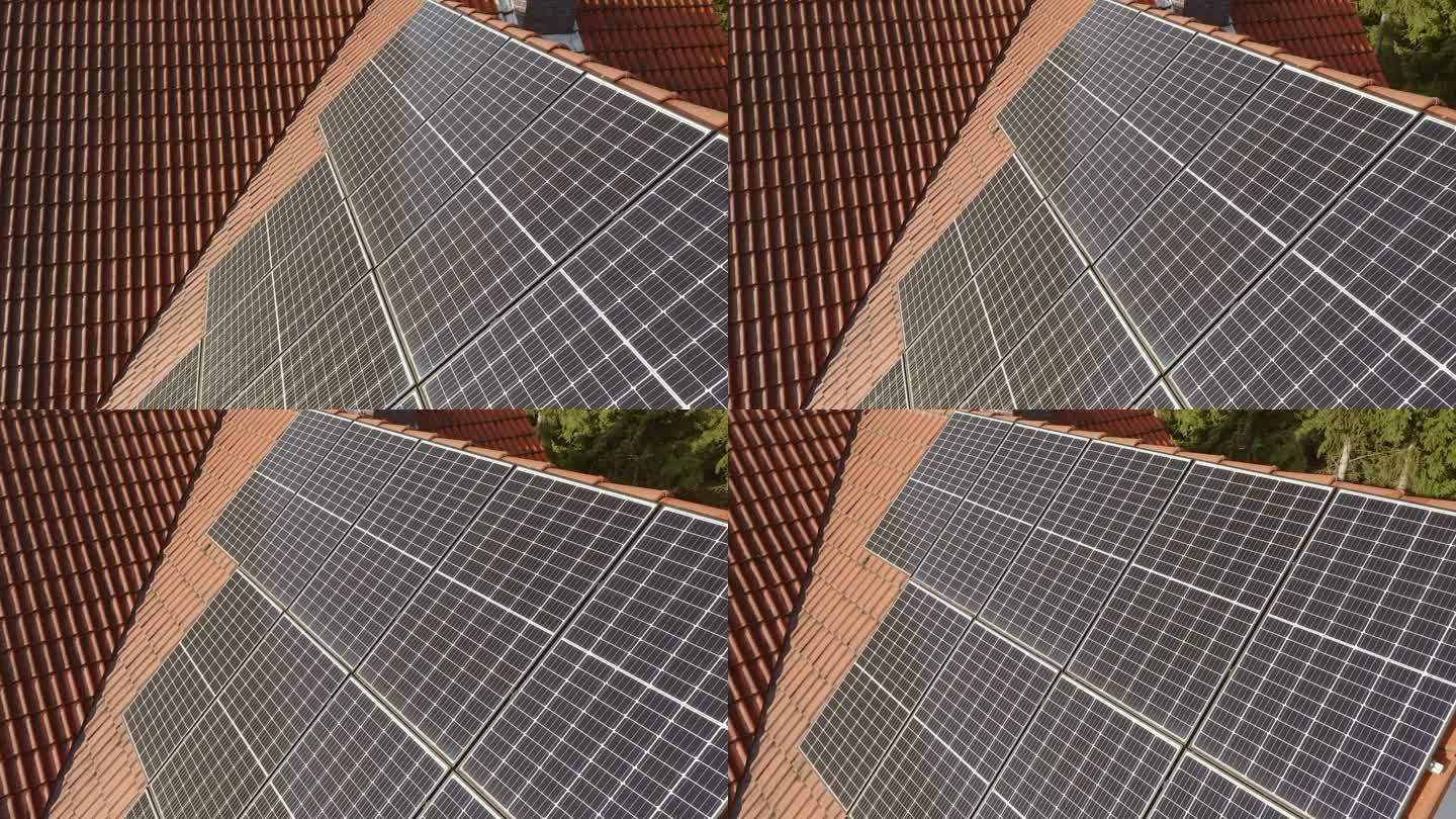 私人住宅瓦片屋顶上的光伏太阳能板。