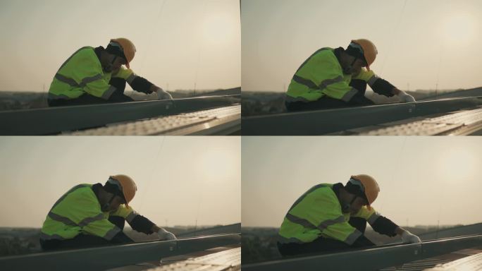 可再生能源检查:亚洲维修工人检查光伏太阳能电池板。