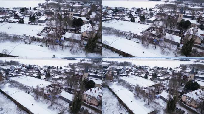 圣诞集市冬雪村，多云的德国。平稳的空中俯视图飞行宽轨道全景无人机

4 k的片段
