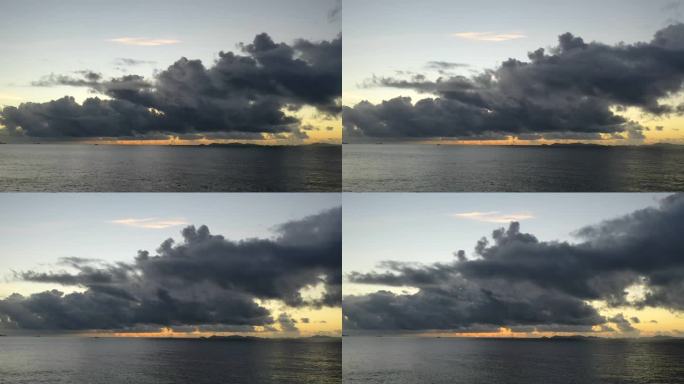 海边日出延时，云和海之间的风景