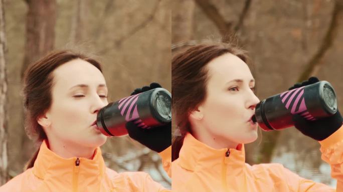 女子在公园剧烈跑完后从瓶子里喝水。垂直视频