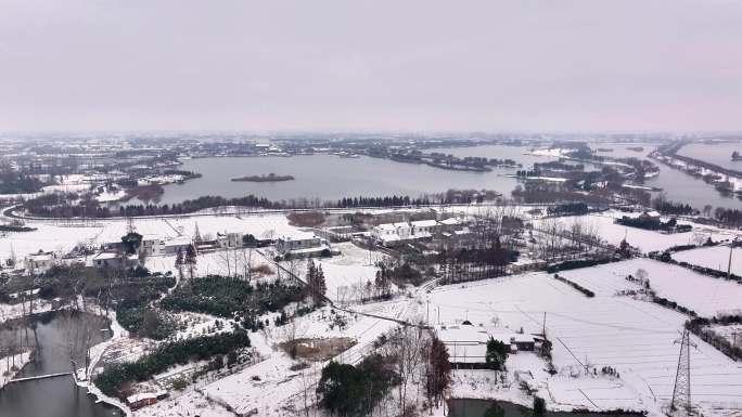 航拍乡镇雪景学校建筑田地大桥别墅河流房屋