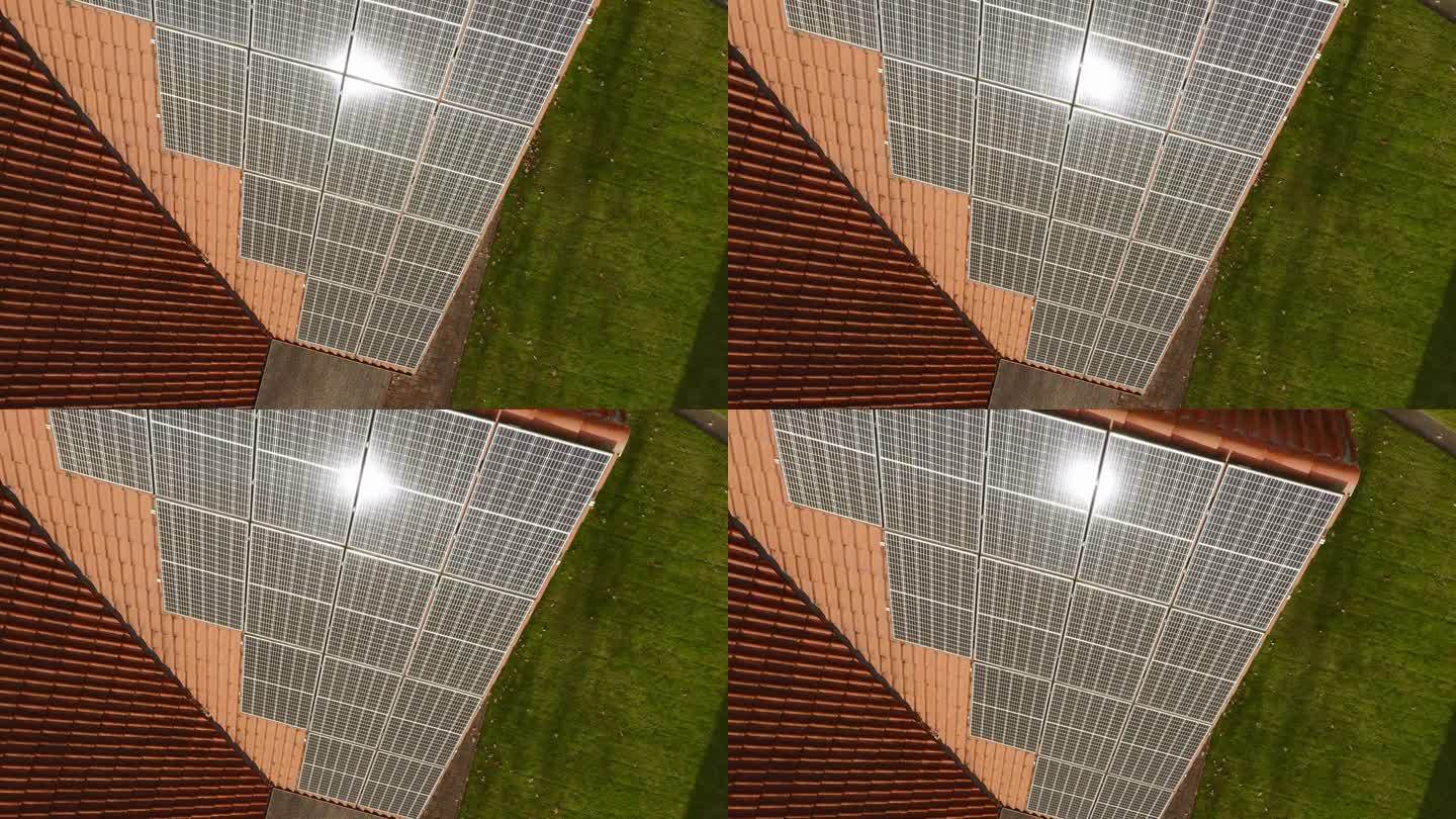 安装在屋顶上的光伏太阳能板上的太阳眩光。