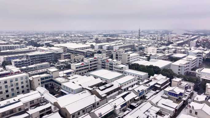 航拍乡镇雪景学校建筑田地大桥别墅河流房屋