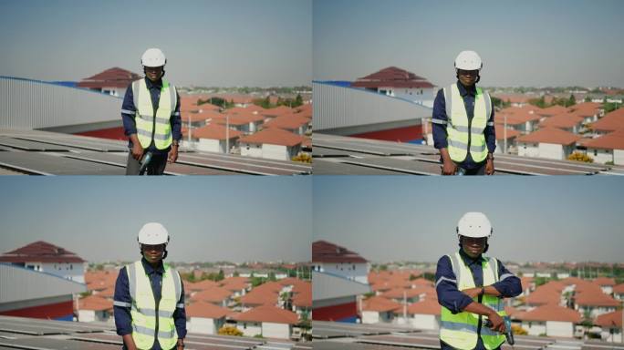 可持续发展的工作:戴着防护头盔的非洲电气工程师在太阳能电池板屋顶上工作-清洁能源创造更光明的未来。