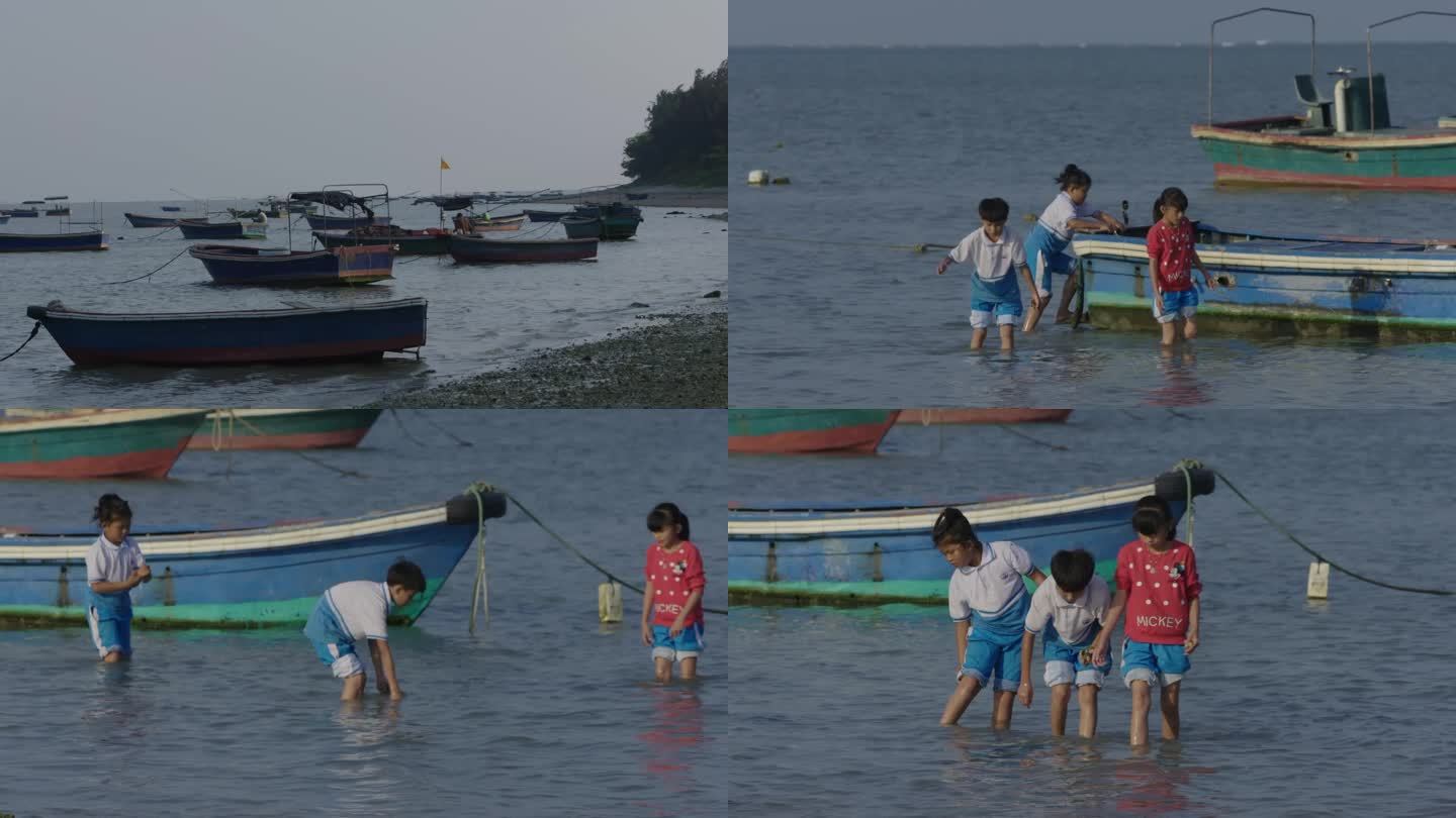 疍家小船和孩子水中玩耍