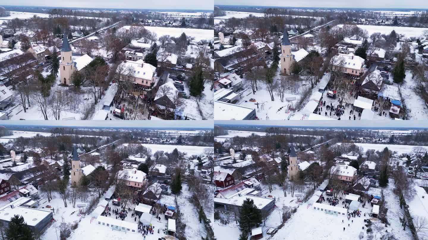 圣诞集市冬雪村，多云的德国。完美的空中俯视图飞行飞行反向无人机

4 k的片段