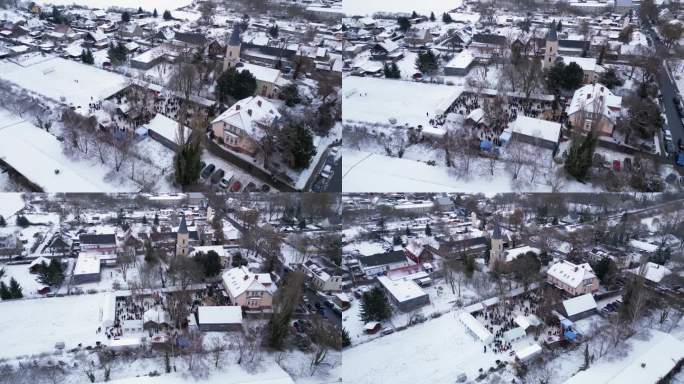 圣诞集市冬雪村，多云的德国。可爱的空中俯瞰飞行全景轨道无人机
4 k的片段