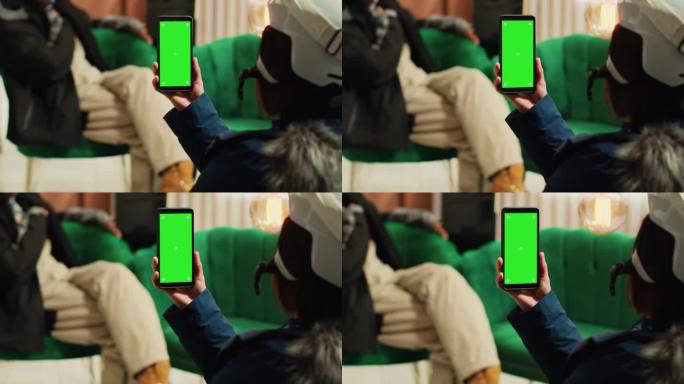 人们使用带有绿屏的智能手机