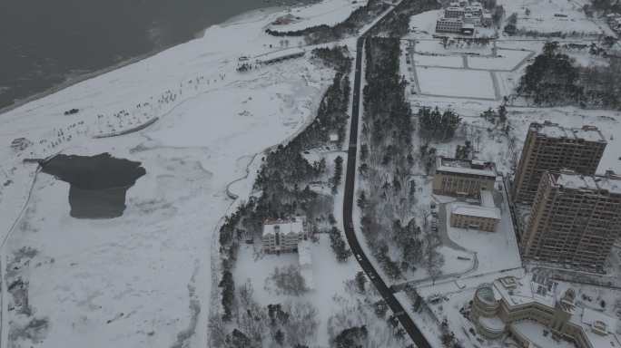 航拍威海市高区大连路小石岛湿地公园雪景