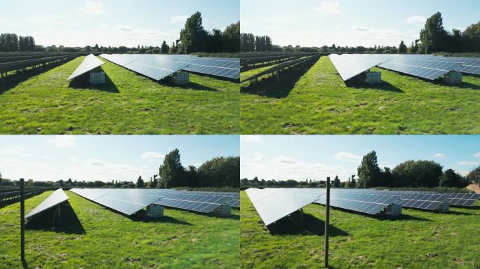 无人机拍摄跟踪过去的太阳能电池板在现场产生可再生的可持续能源