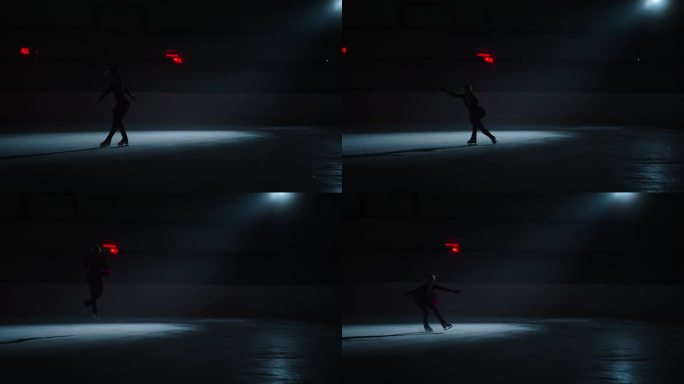 惊人的冰上表演，优雅的女子花样滑冰运动员在冰上表演元素的剪影