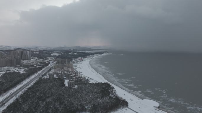 航拍威海西海岸日落湾冬季雪后傍晚霞光