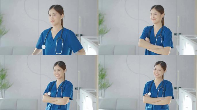 美丽的亚洲女医生的肖像迷人的微笑和交叉手臂，护士戴着磨砂微笑温暖舒适，积极的情绪和良好的时刻，听诊器