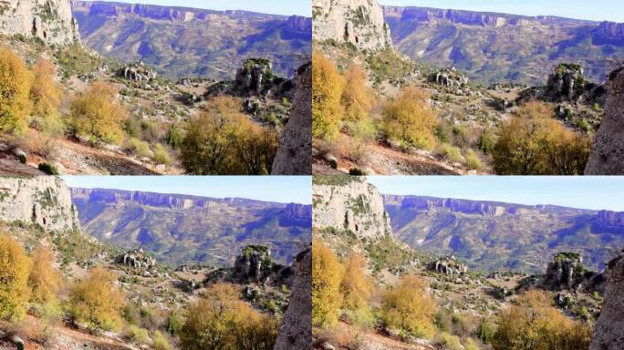 山景迷人，岩石峡谷秋谷尽收眼底。陡峭的高崖，巨大的石头丰富了山地景观。理想的风景山景镜头