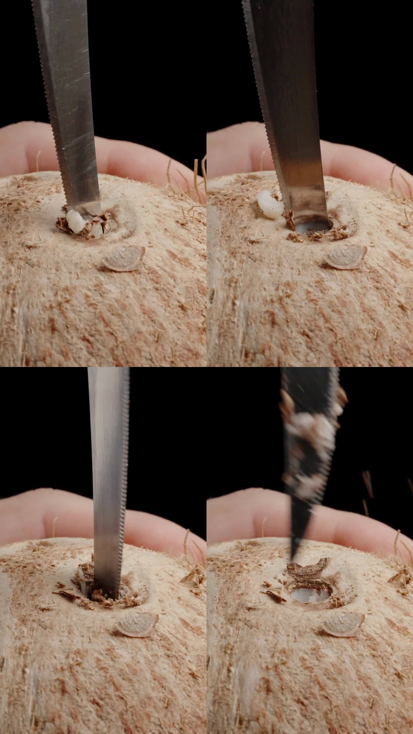 垂直视频。特写:一个男人手拿着椰子，在上面钻一个洞，插入一根稻草。
