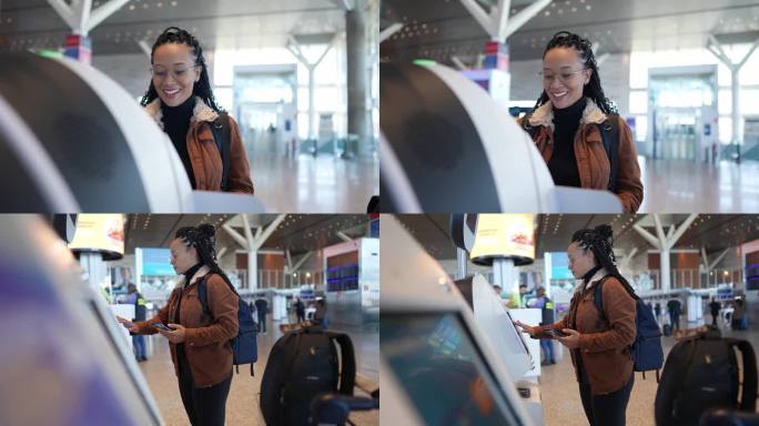 年轻女子在机场使用手机和值机机