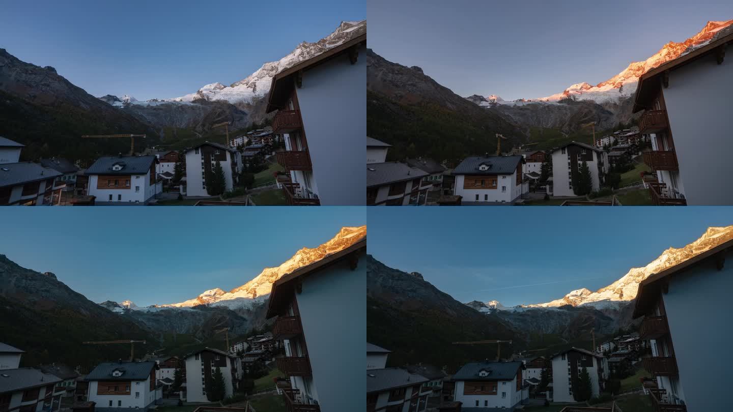 瑞士萨斯费村冰川格莱彻瑞士村晴朗的日出早晨电影延时起重机移动建筑工地区山峰照亮了第一缕光令人惊叹