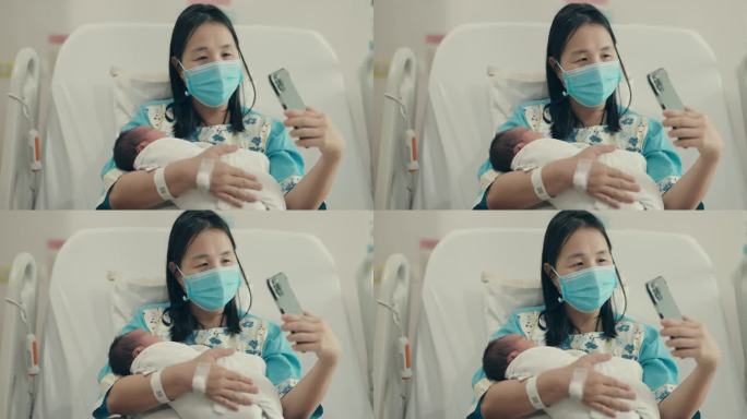 虚拟连接:亚洲孕妇拥抱母性，对着新生儿微笑，同时用智能手机和奶奶聊天。