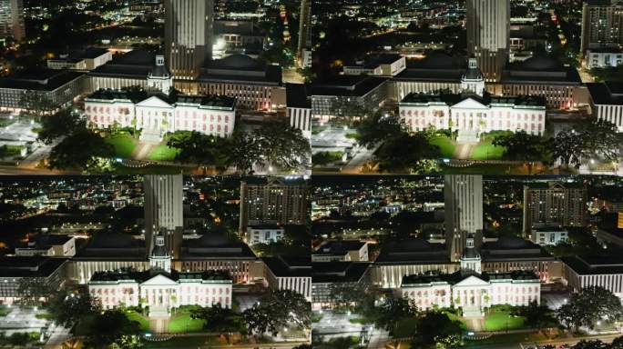 佛罗里达州塔拉哈西市中心的夜景。州议会大厦坐落在商业区的中心。航拍镜头与广泛的平移-轨道-倾斜向下的