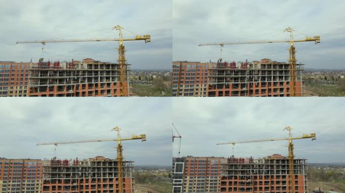 施工现场高层住宅楼塔式起重机与框架结构。房地产开发