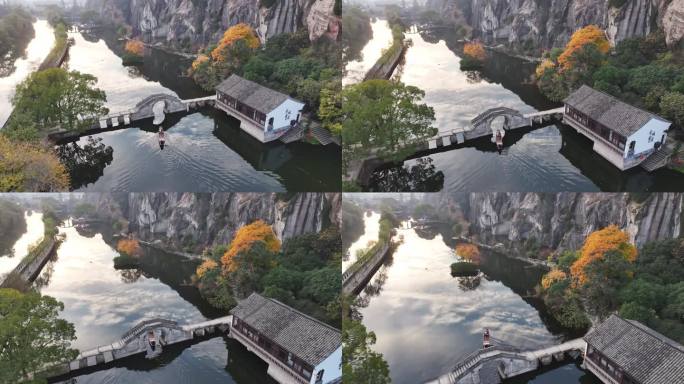 绍兴东湖 湖面上划着船穿过石桥