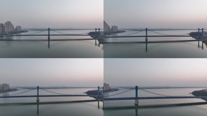 航拍候鸟群飞过襄阳汉江桥梁城市风光