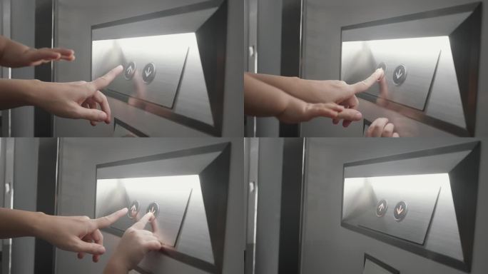 男孩的手在按电梯按钮。