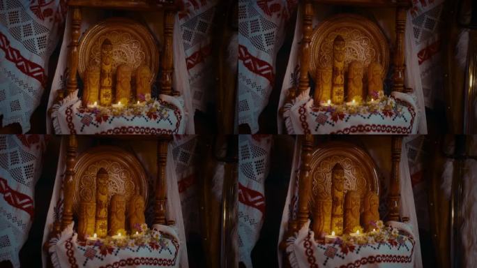 古代房屋内部斯拉夫诸神木制偶像和蜡烛，特写，4K, Prores