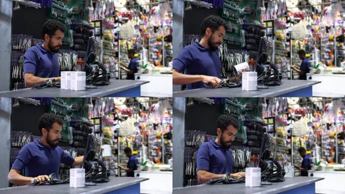 在一家五金店扫描油漆罐，准备送货单的拉丁美洲推销员