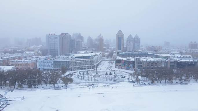 4k防洪纪念塔下雪哈尔滨道里区航拍松花江