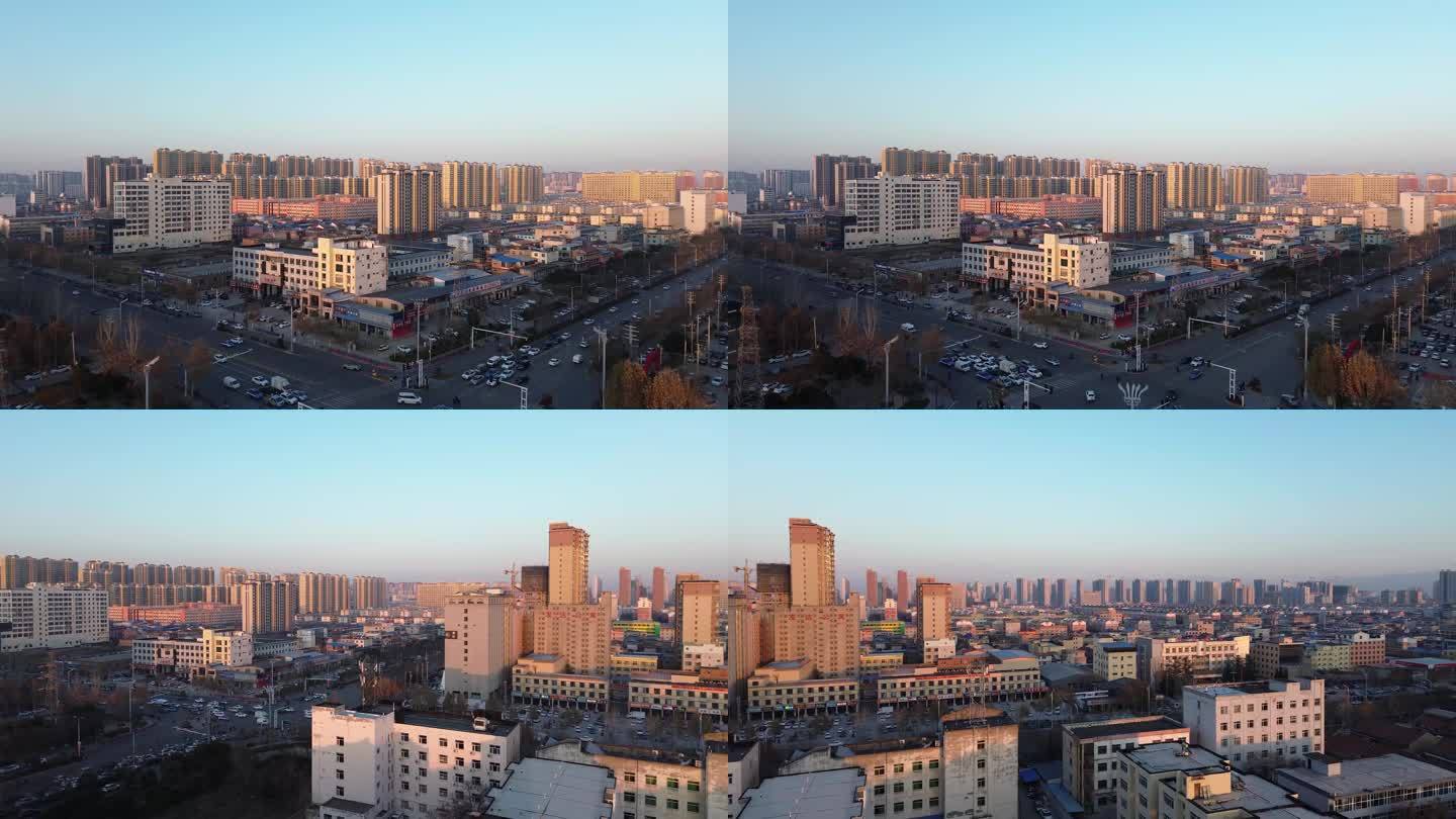 夕阳下城市建筑群，光影冷暖对比