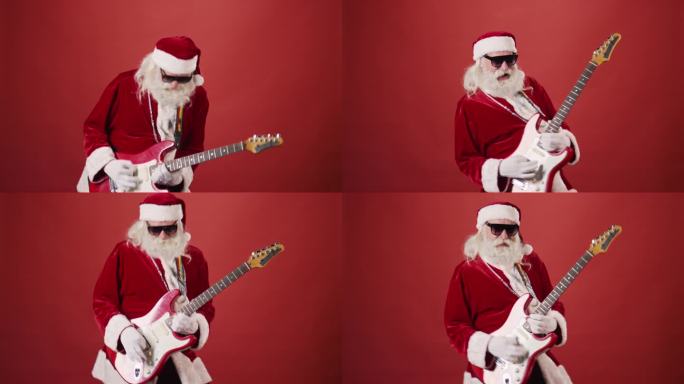 戴墨镜的圣诞老人在红色背景上弹奏电吉他