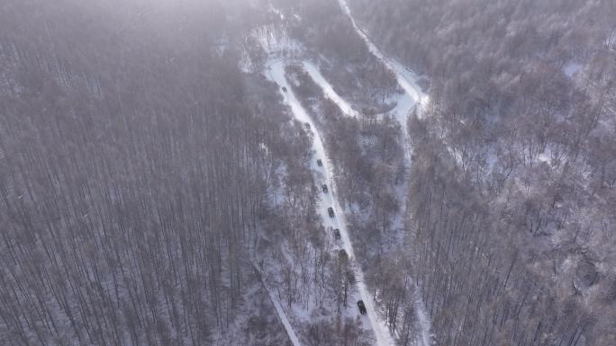 山间雪路爬坡原始森林四驱激情驾驶航拍