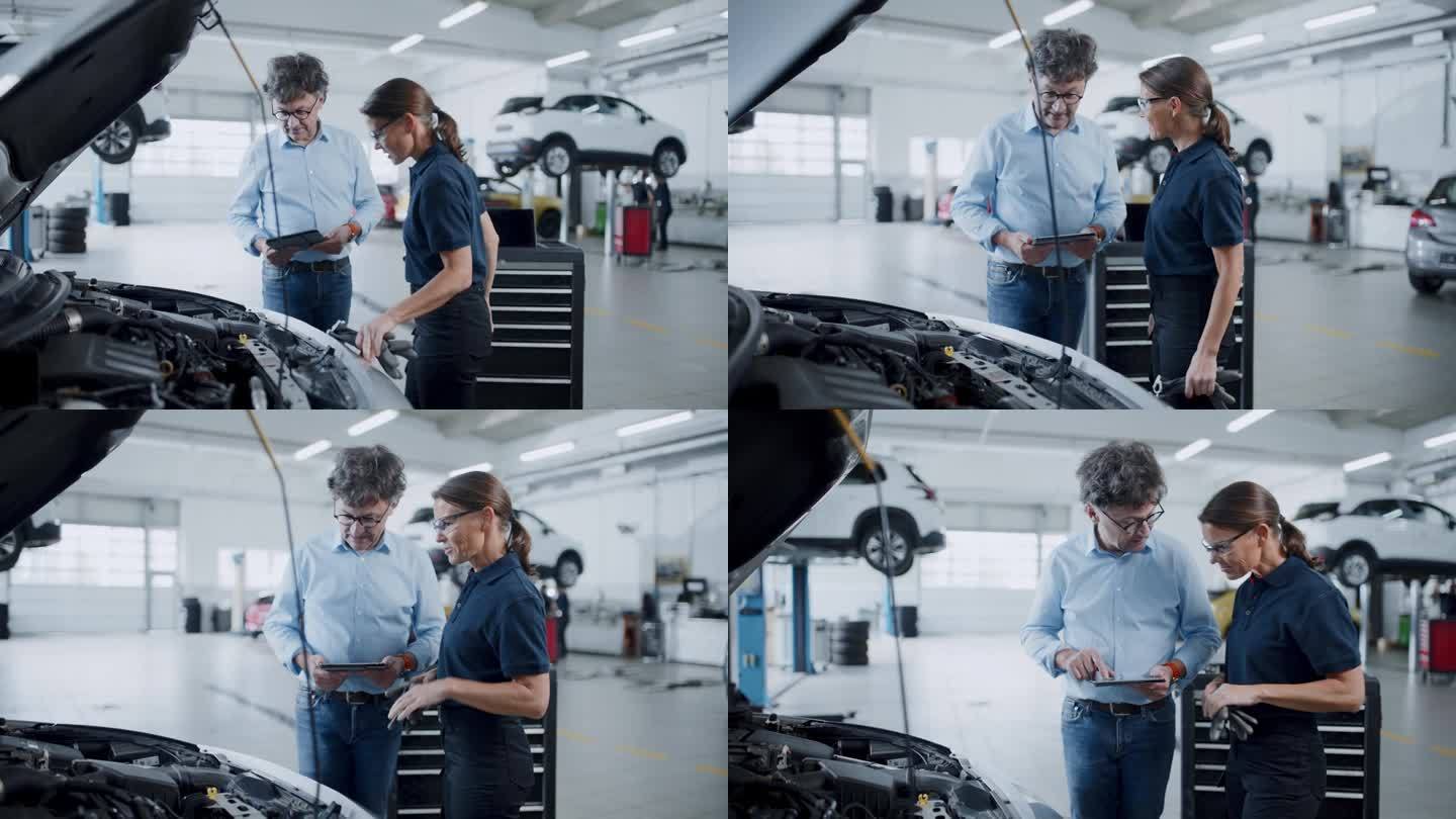 机械师和经理在汽车修理厂讨论发动机维修