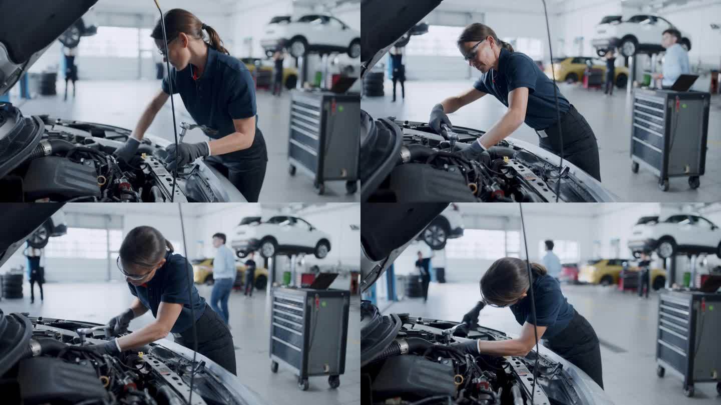 女机械师在汽车修理店修理汽车发动机
