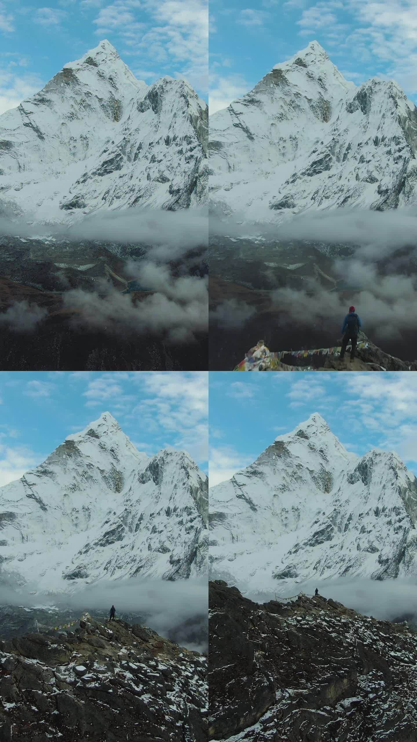 一名男子在楠格曾峰上望着阿玛达布拉姆山。尼泊尔的喜马拉雅山脉。鸟瞰图。垂直视频