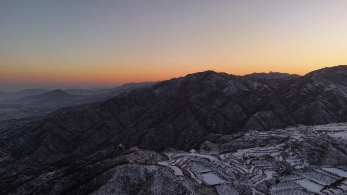 航拍北方雪后山峰湖农村