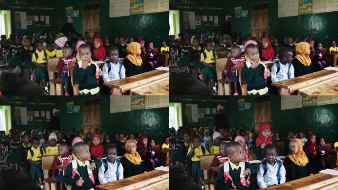 孩子们坐在教室里的慢镜头。男孩和女孩在农村上学。教育大楼内部。
