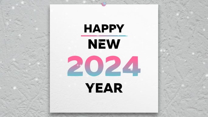 新版2024年日历的第一页特写，上面写着新年快乐，周围是飘落的雪花