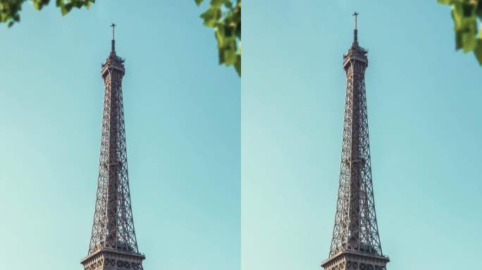 在一个阳光明媚的日子里，法国著名的巴黎埃菲尔铁塔，放大镜头。垂直视频的故事和卷轴
