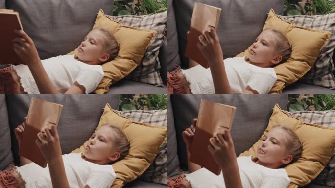 青春期前女孩读物小女孩躺着看书
