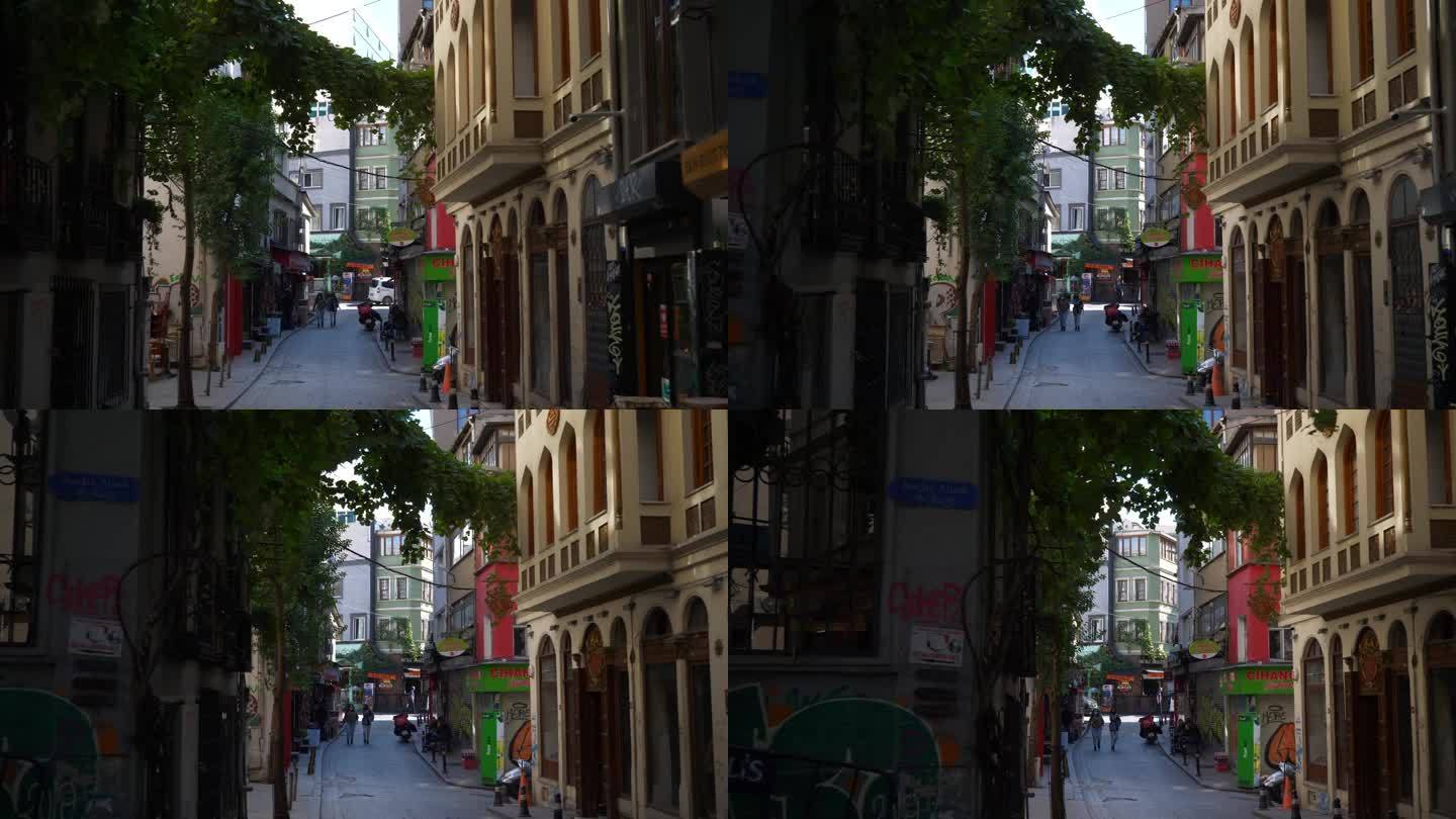 阳光明媚的一天伊斯坦布尔市中心著名的老城区狭窄的街景慢动作全景4k土耳其