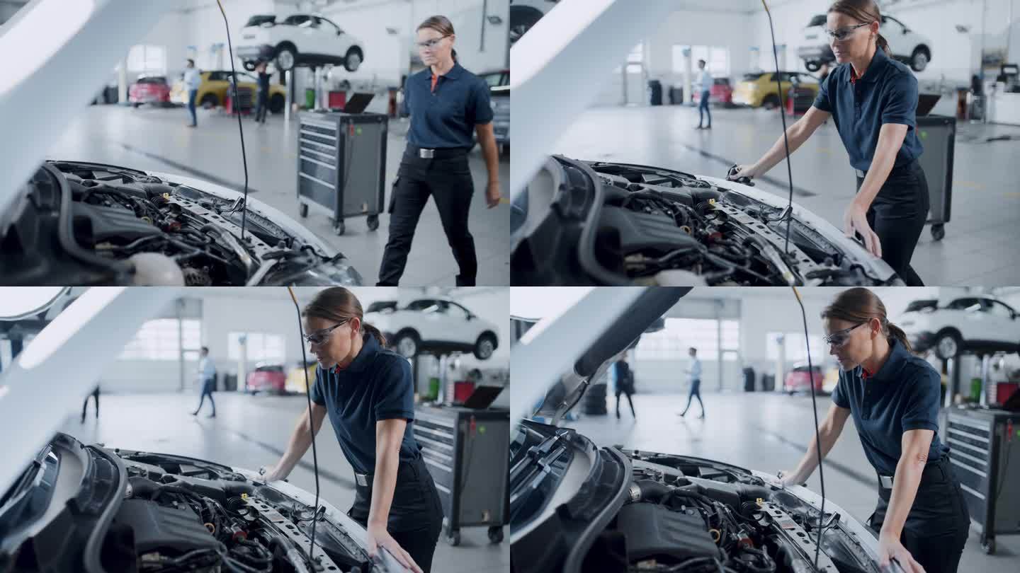 女机械师在汽车修理店检查汽车发动机