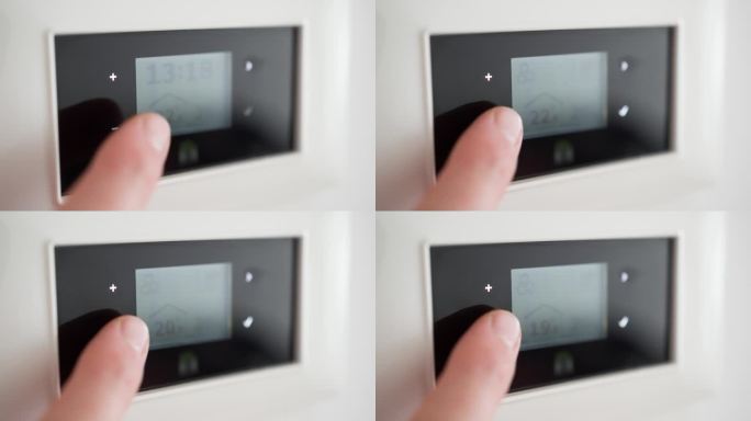 在智能恒温器的触摸面板上调节温度