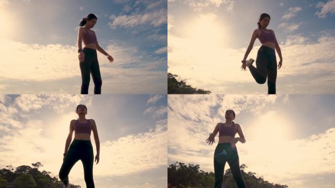 女人在沙滩上跑步热身拉伸拉练大长腿