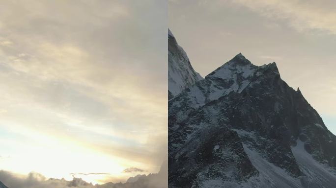 Ama Dablam山和日落时的徒步旅行者。尼泊尔的喜马拉雅山脉。鸟瞰图。垂直视频