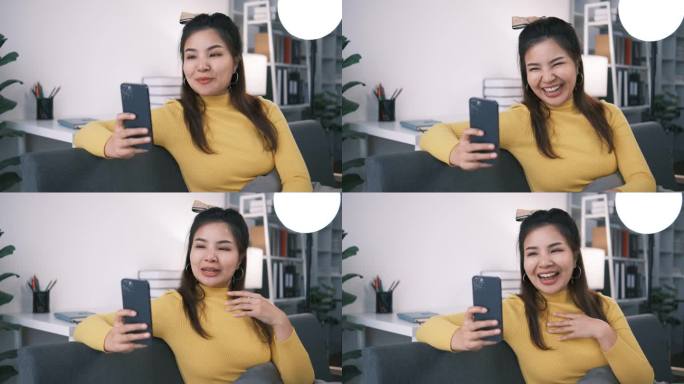 快乐的亚洲少女挥手使用智能手机应用程序享受在线虚拟聊天视频电话与朋友在远程移动聊天虚拟会议，记录故事