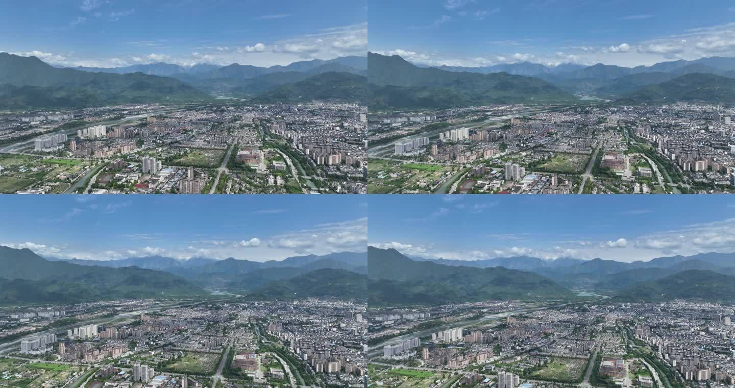 四川都江堰5K雪山下的公园城市航拍大景