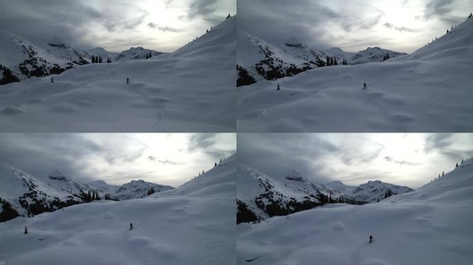 男子滑雪穿越雪山冬季景色冬季野外冬景鸟瞰